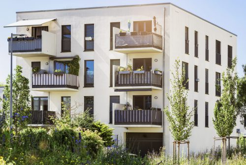 Modern Facade Building with Modern Balcony with Solar Panels and of Multifamily Low rise Apartment Building. Residential Building Exterior Design of Modern Homes and Town houses.